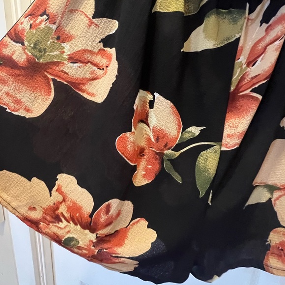 NWOT. Black flowy floral off the shoulder 3/4 sleeve romper. - Picture 4 of 11